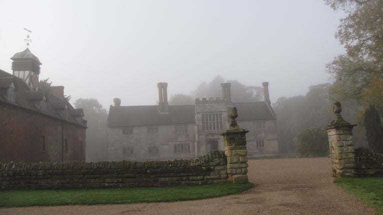 A misty autumn morning at Baddesley Clinton